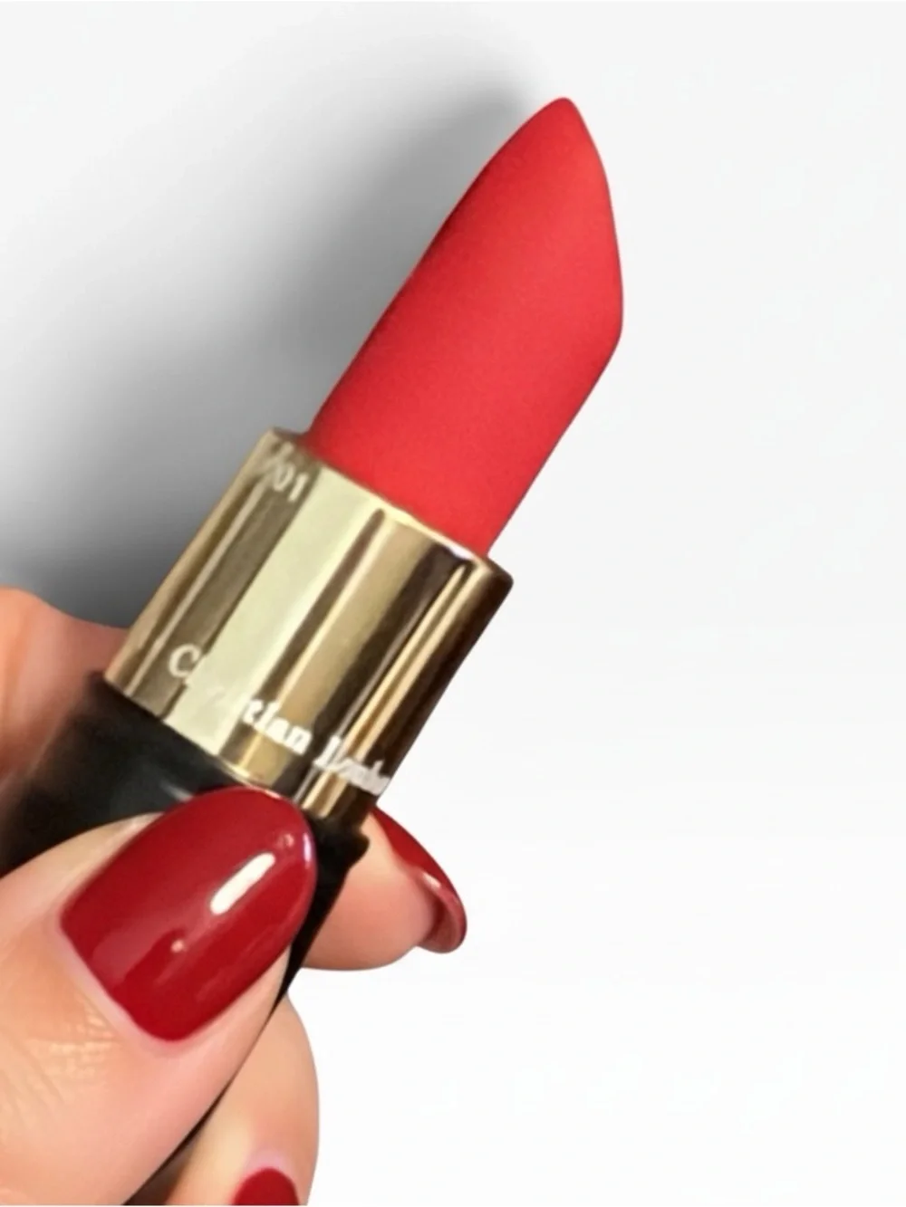 Christian Louboutin Black Spike-Detail Lipstick Holder with red lipstick